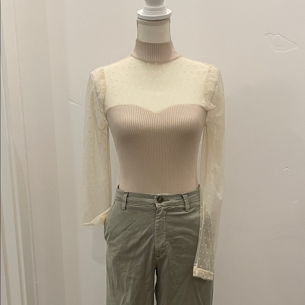 Elegant Knit Mock Neck Cream Bodysuit w Sheer Polka Dots. 2 button snap closure.